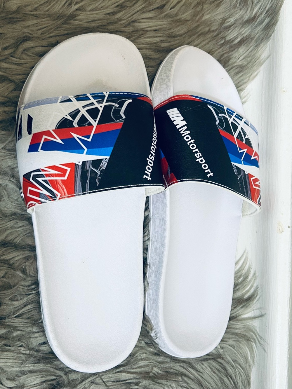 Puma White Slide Sandals with Red & Black Graphic Strap